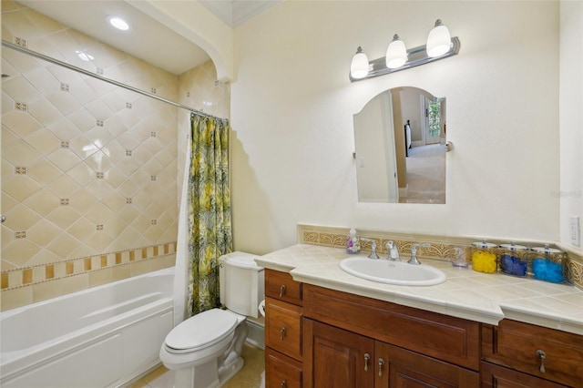 bathroom featuring toilet, vanity, and shower / tub combo with curtain