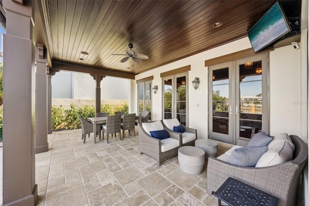 view of patio with french doors, ceiling fan, outdoor dining area, and an outdoor hangout area