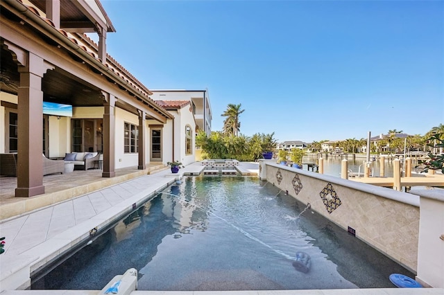 view of pool with a water view