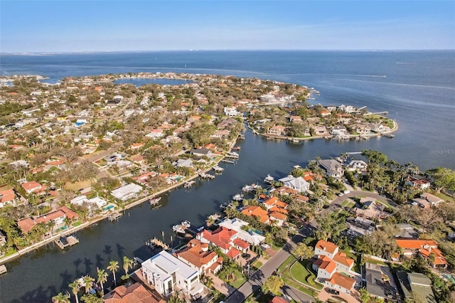 drone / aerial view with a water view and a residential view