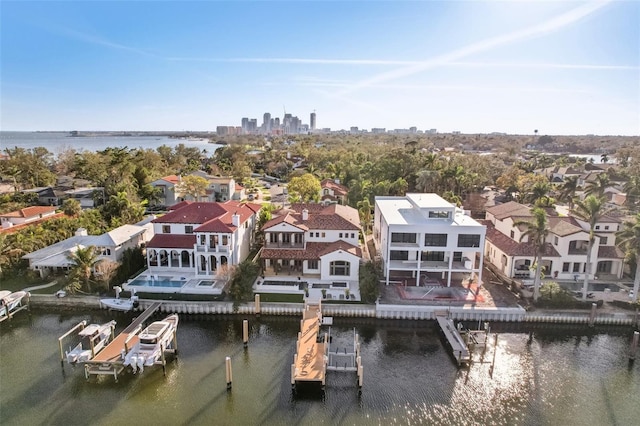 birds eye view of property with a residential view and a water view