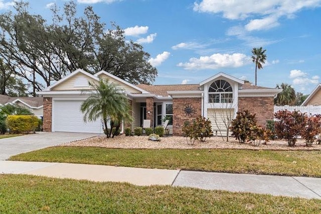 ranch-style home with a garage and a front lawn