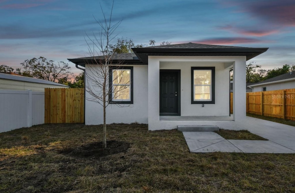 view of front of property with a lawn