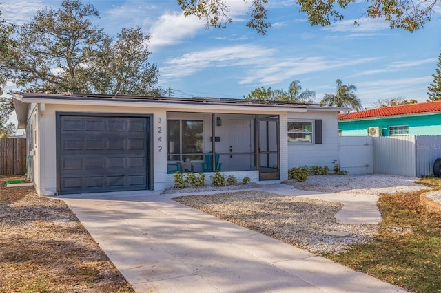 single story home with a garage