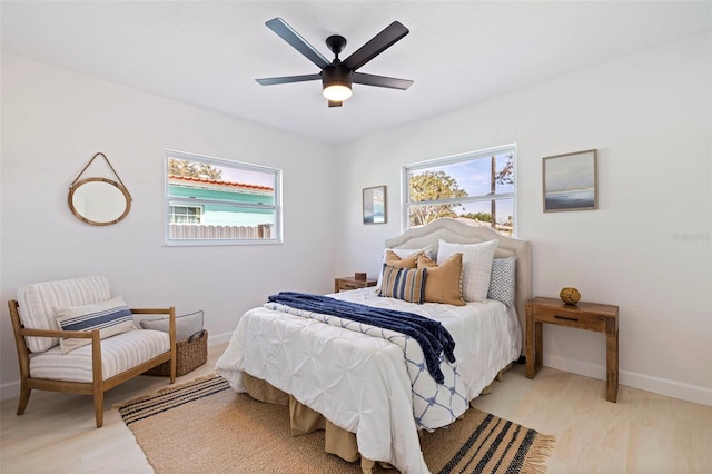 bedroom featuring ceiling fan and light hardwood / wood-style floors