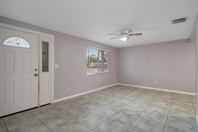 entrance foyer with ceiling fan and light tile patterned floors