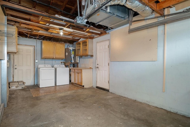 basement with washing machine and clothes dryer