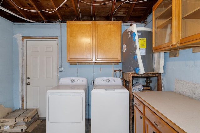 laundry area with cabinets and washing machine and clothes dryer