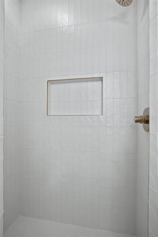 bathroom with tiled shower