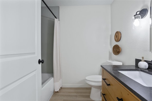 full bathroom featuring shower / tub combo, vanity, toilet, and hardwood / wood-style floors