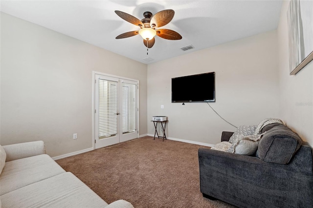 living room with ceiling fan and carpet floors