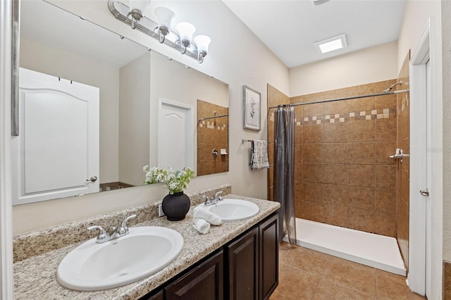 bathroom featuring vanity, curtained shower, and tile patterned floors