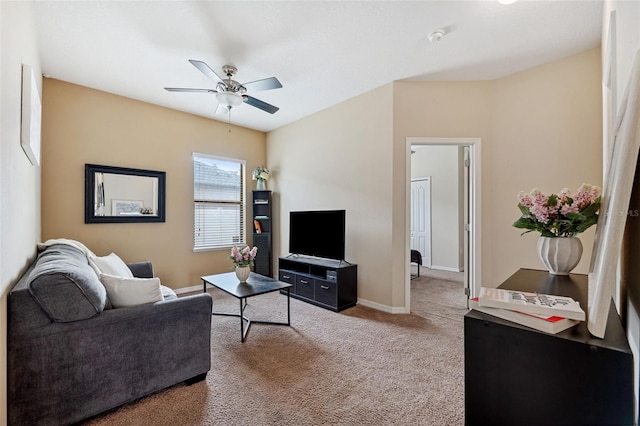 living room with ceiling fan and carpet flooring