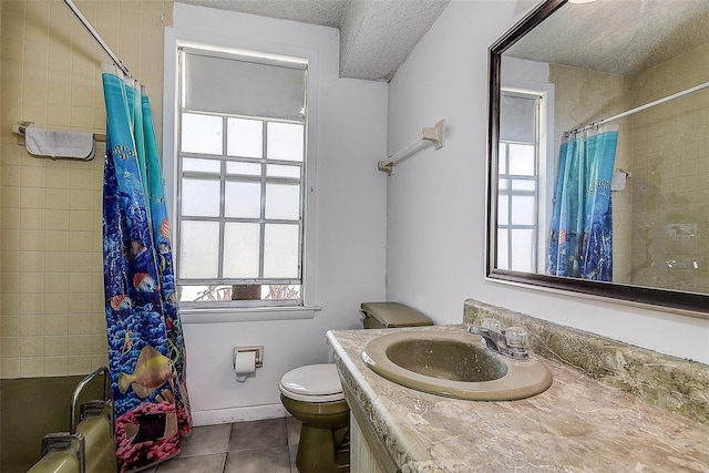 full bathroom with shower / tub combo with curtain, tile patterned flooring, vanity, a textured ceiling, and toilet