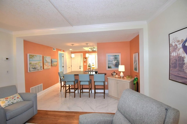 dining space with crown molding and a textured ceiling