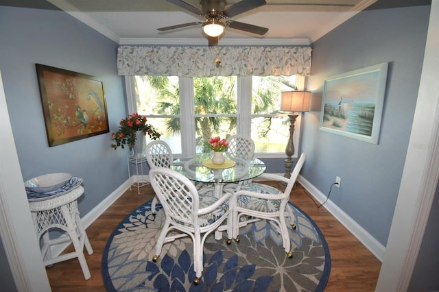 dining room featuring ceiling fan, ornamental molding, and dark hardwood / wood-style flooring