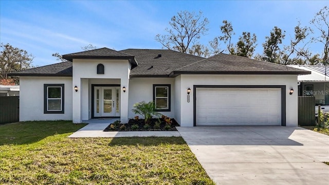 view of front of property with a garage and a front yard