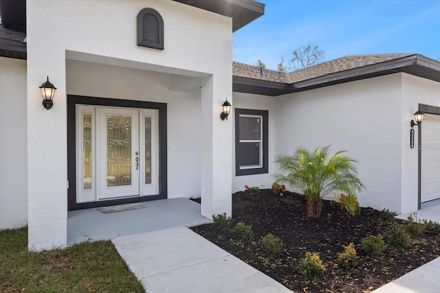 property entrance with a garage