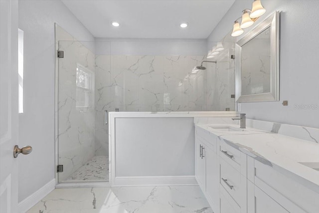 bathroom with an enclosed shower and vanity