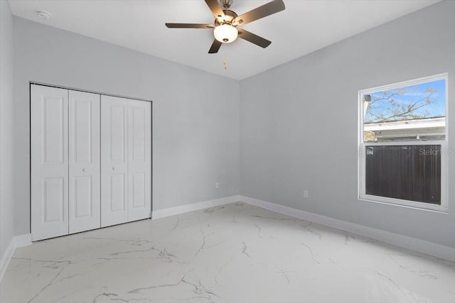 unfurnished bedroom with a closet and ceiling fan