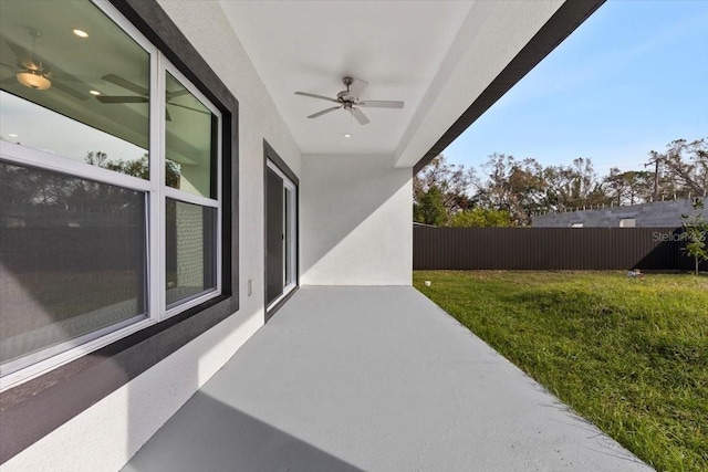 view of patio featuring ceiling fan