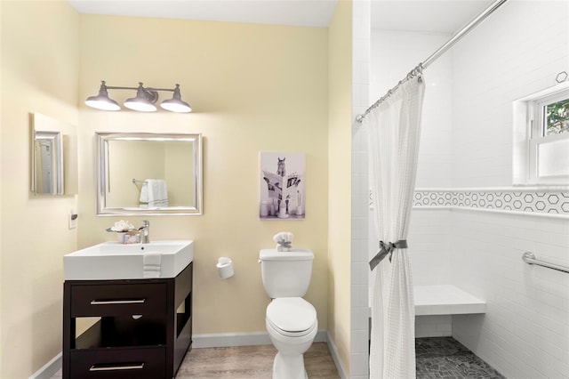 bathroom featuring vanity, toilet, a shower with shower curtain, and wood-type flooring