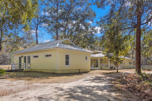 view of home's exterior featuring covered porch