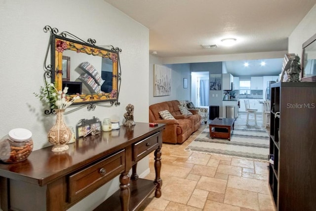 interior space featuring visible vents and stone tile floors