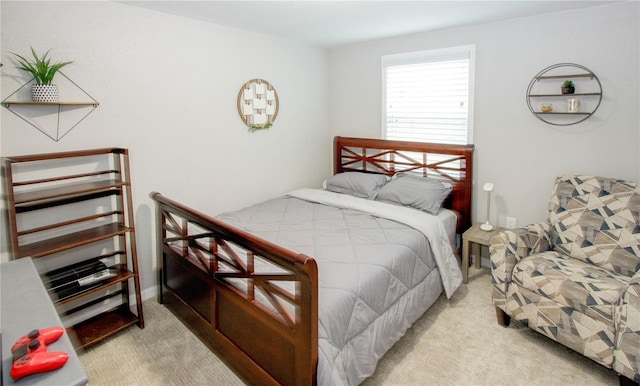 bedroom featuring light carpet