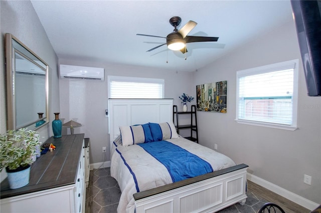 bedroom with lofted ceiling, ceiling fan, baseboards, and an AC wall unit