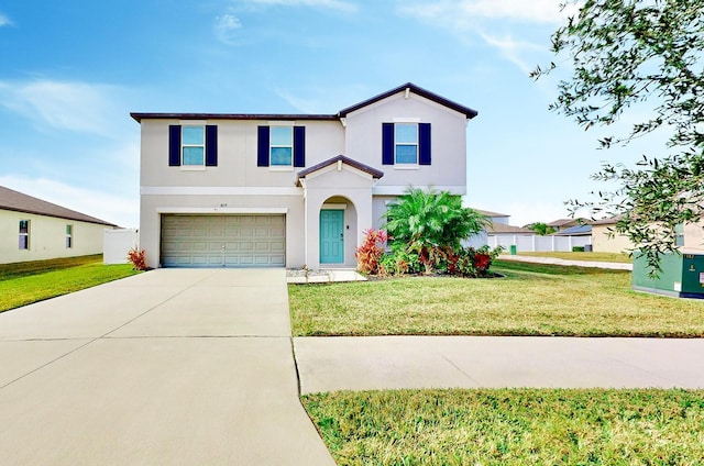 view of front of home with a garage and a front yard