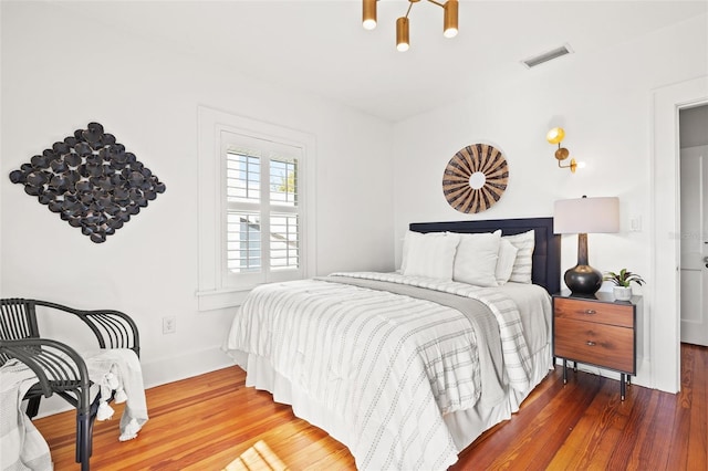 bedroom featuring hardwood / wood-style flooring