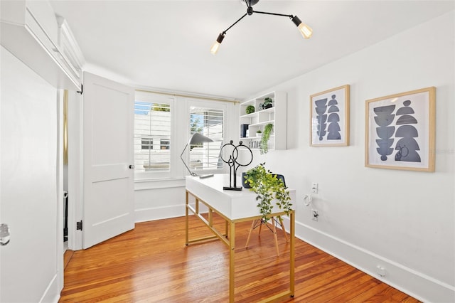 office space with light hardwood / wood-style floors