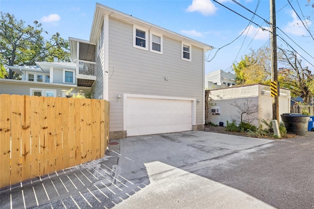 view of side of home featuring a garage