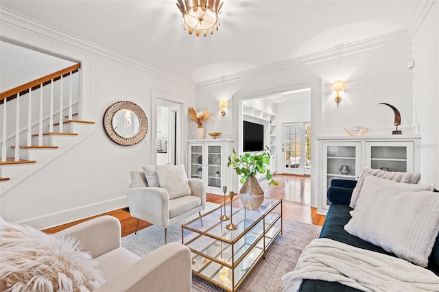 living room featuring ornamental molding and wood-type flooring