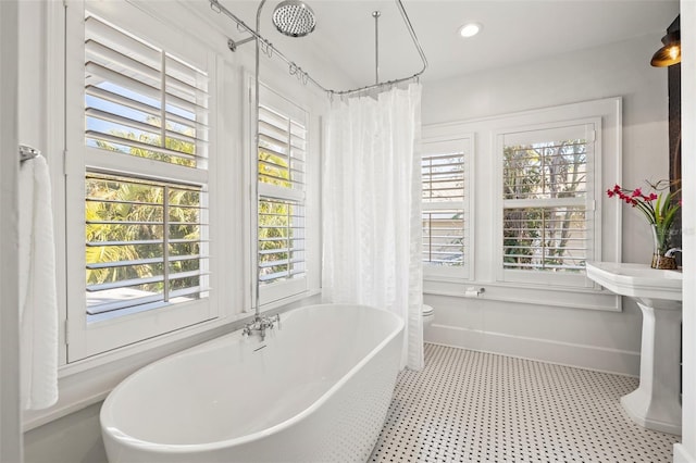 bathroom with shower / tub combo with curtain and toilet