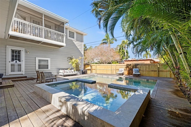 view of pool featuring outdoor lounge area and a deck