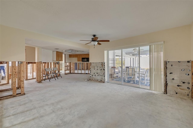 unfurnished living room with ceiling fan