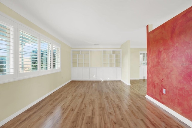 spare room featuring light wood-type flooring