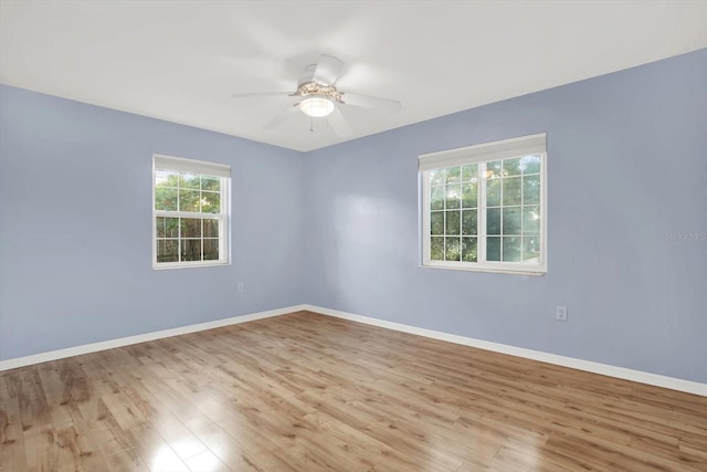 spare room featuring ceiling fan and light hardwood / wood-style floors