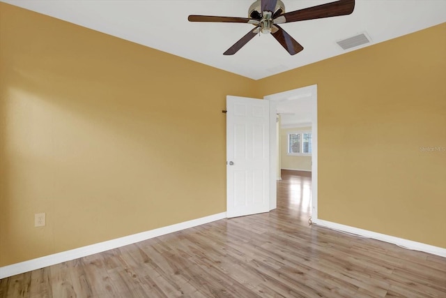 spare room with ceiling fan and light hardwood / wood-style floors