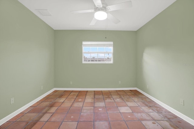 empty room with tile patterned flooring and ceiling fan