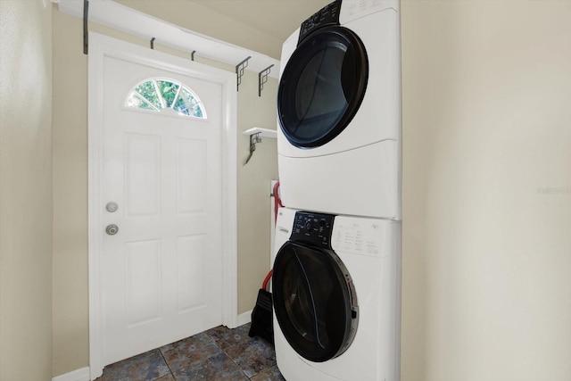 laundry area featuring stacked washer / dryer