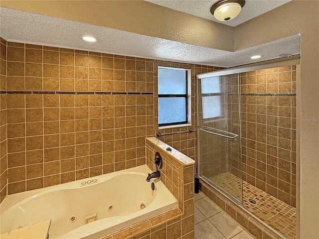 bathroom featuring tile patterned floors and a textured ceiling