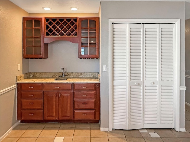 kitchen with light tile patterned flooring and sink