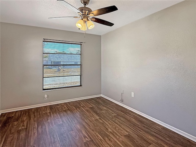 empty room with ceiling fan, a textured ceiling, and dark hardwood / wood-style flooring