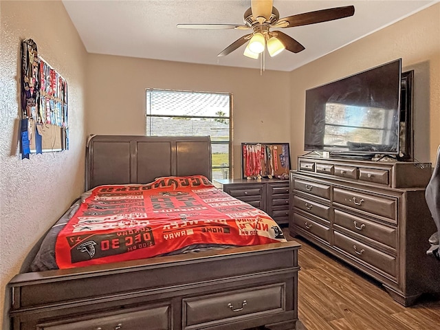 bedroom featuring dark wood-type flooring and ceiling fan