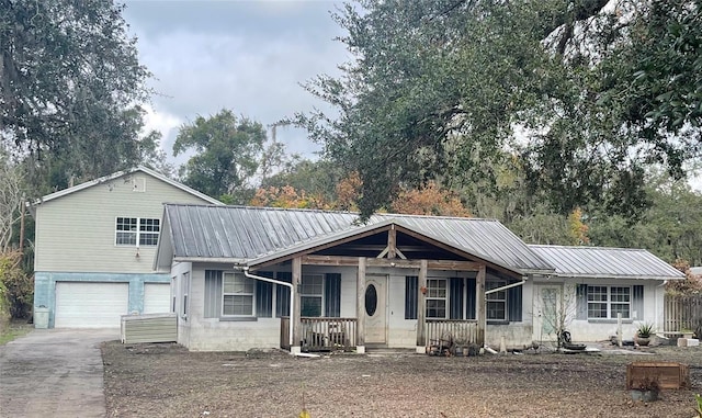 view of front of home with a porch and a garage