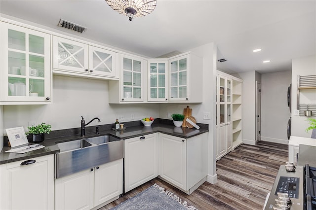 kitchen featuring dark hardwood / wood-style floors, sink, and white cabinets