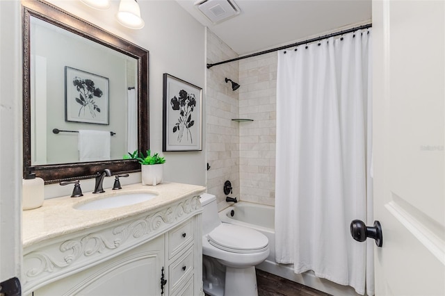 full bathroom with toilet, vanity, shower / bathtub combination with curtain, and hardwood / wood-style flooring